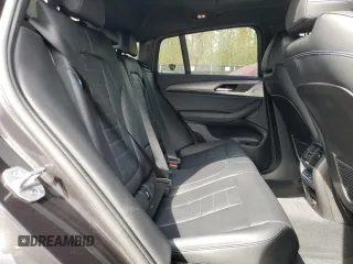 2019 BMW X4 M40i with VIN 5UXUJ5C5XKLJ64004, listed as a Copart auction lot 52106895 with 74,599 mi miles and Salvage title. Bid and sale history available at DreamBid. Image 12.
