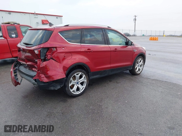 2019 Ford Escape Titanium z VIN 1FMCU9J99KUA18880, wystawiony jako IAAI lot #40830436 z przebiegiem 117 499 mil mil oraz . Historia ofert i sprzedaży dostępna na DreamBid. Obrazek 4.