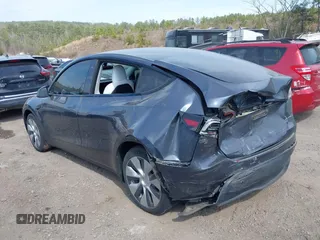 2022 Tesla Model Y Long Range z VIN 7SAYGDEE2NF447998, wystawiony jako IAAI lot #41704968 z przebiegiem 34 088 mil mil oraz . Historia ofert i sprzedaży dostępna na DreamBid. Obrazek 3.