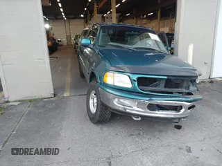 1997 Ford F-150 XL with VIN 1FTEX18L1VKB44867, listed as a IAAI auction lot 41266572 with 105,061 mi miles. Bid and sale history available at carsss.com. Image 1.