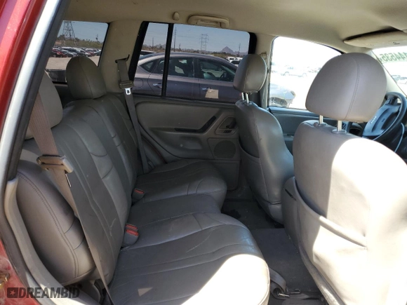 2004 Jeep Grand Cherokee Laredo with VIN 1J4GW48N84C311923, listed as a Copart auction lot 52144535 with 231,069 mi miles and Salvage Title. Bid and sale history available at carsss.com. Image 11.
