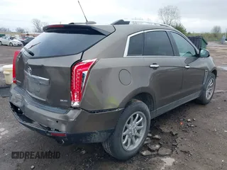 2015 Cadillac SRX Luxury Collection with VIN 3GYFNBE34FS521518, listed as a IAAI auction lot 41893073 with 82,700 mi miles and . Bid and sale history available at carsss.com. Image 4.