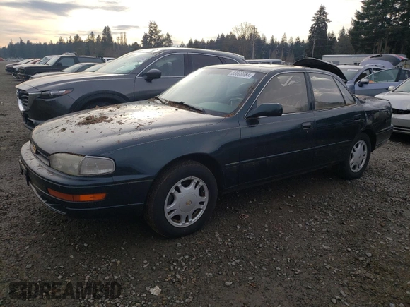 1994 Toyota Camry XLE with VIN JT2GK13E2R0008225, listed as a Copart auction lot 83668084 with 258,735 mi miles and Salvage Title. Bid and sale history available at carsss.com. Image 1.