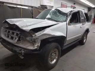2000 Ford Explorer z VIN 1FMYU60XXYUA34664, wystawiony jako IAAI lot #41980401 z przebiegiem 179 946 mil mil oraz . Historia ofert i sprzedaży dostępna na DreamBid. Obrazek 2.