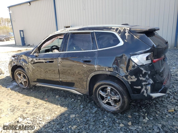 2025 BMW X1 xDrive28i with VIN WBX73EF00S5111795, listed as a Copart auction lot 48765255 with 12,042 mi miles and Salvage Title. Bid and sale history available at carsss.com. Image 2.