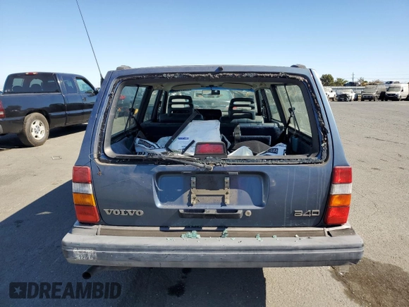 1993 Volvo 240 with VIN YV1AW8311P1955233, listed as a Copart auction lot 76514004 with 216,723 mi miles and Salvage title. Bid and sale history available at DreamBid. Image 6.