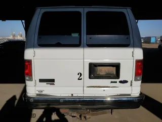 2013 Ford Econoline Wagon XL with VIN 1FBSS3BL0DDA77076, listed as a Copart auction lot 70474004 with 154,679 mi miles and Salvage Title. Bid and sale history available at carsss.com. Image 6.