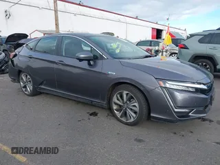 2018 Honda Clarity z VIN JHMZC5F12JC002729, wystawiony jako IAAI lot #40605554 z przebiegiem 53 996 mil mil oraz . Historia ofert i sprzedaży dostępna na DreamBid. Obrazek 1.