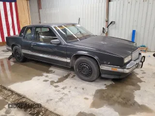 1988 Cadillac Eldorado z VIN 1G6EL1154JU615807, wystawiony jako Copart lot #76362924 z przebiegiem Nie podano mil oraz Tytuł czysty. Historia ofert i sprzedaży dostępna na DreamBid. Obrazek 4.