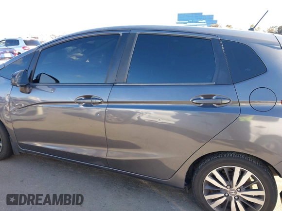 2015 Honda Fit EX-L z VIN 3HGGK5H89FM774299, wystawiony jako IAAI lot #41793448 z przebiegiem 142 228 mil mil oraz . Historia ofert i sprzedaży dostępna na DreamBid. Obrazek 14.