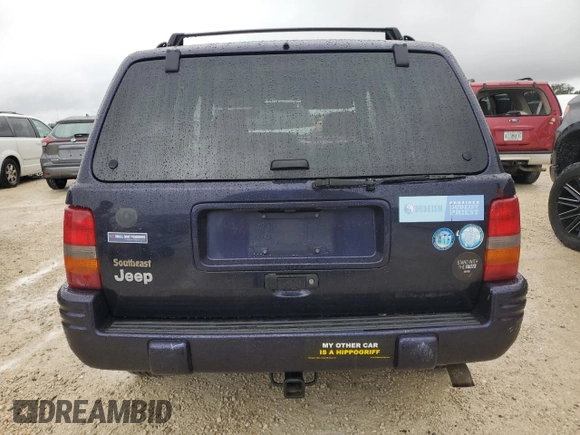 1998 Jeep Grand Cherokee with VIN 1J4FX48S1WC244308, listed as a Copart auction lot 74384714 with Not provided miles and Non repairable. Bid and sale history available at DreamBid. Image 6.