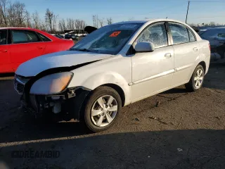 2010 Kia Rio LX with VIN KNADH4A35A6691869, listed as a Copart auction lot 42025785 with 126,381 mi miles and Salvage Title. Bid and sale history available at carsss.com. Image 1.