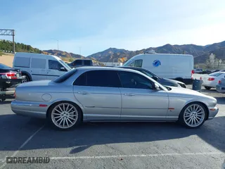 2004 Jaguar XJ with VIN SAJWA73B94TG30153, listed as a IAAI auction lot 41218841 with 91,158 mi miles. Bid and sale history available at carsss.com. Image 13.