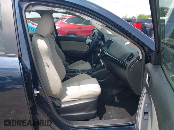 2016 Mazda CX-5 Sport z VIN JM3KE2BY0G0633611, wystawiony jako IAAI lot #42390654 z przebiegiem Nie podano mil oraz . Historia ofert i sprzedaży dostępna na DreamBid. Obrazek 5.
