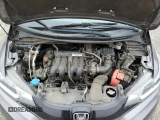 2015 Honda Fit LX z VIN 3HGGK5H58FM785137, wystawiony jako Copart lot #59013315 z przebiegiem 84 592 mil mil oraz Szkoda całkowita • Salvage title. Historia ofert i sprzedaży dostępna na DreamBid. Obrazek 11.