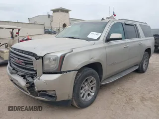 2015 GMC Yukon XL SLE z VIN 1GKS1GKC1FR155056, wystawiony jako IAAI lot #41517607 z przebiegiem 174 634 mil mil oraz . Historia ofert i sprzedaży dostępna na DreamBid. Obrazek 2.