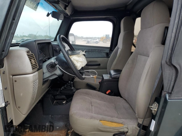2003 Jeep Wrangler SE with VIN 1J4FA29103P313229, listed as a Copart auction lot 79337984 with 135,668 mi miles and Salvage title. Bid and sale history available at DreamBid. Image 7.