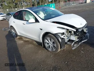 2024 Tesla Model Y Long Range with VIN 7SAYGDEE1RF056816, listed as a IAAI auction lot 41809125 with 6,434 mi miles and . Bid and sale history available at DreamBid. Image 1.