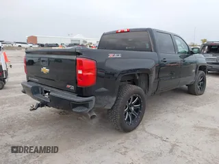 2017 Chevrolet Silverado 1500 LT with VIN 1GCUKREC2HF208232, listed as a IAAI auction lot 40933445 with 105,928 mi miles and . Bid and sale history available at DreamBid. Image 4.