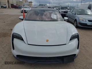 2022 Porsche Taycan z VIN WP0AA2Y10NSA12920, wystawiony jako IAAI lot #42047850 z przebiegiem 22 300 mil mil oraz . Historia ofert i sprzedaży dostępna na DreamBid. Obrazek 6.