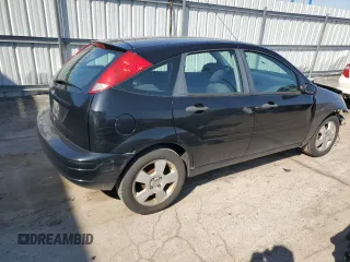 2007 Ford Focus S z VIN 1FAHP37N07W161088, wystawiony jako Copart lot #54140415 z przebiegiem 241 367 mil mil oraz Szkody całkowita. Historia ofert i sprzedaży dostępna na DreamBid. Obrazek 3.