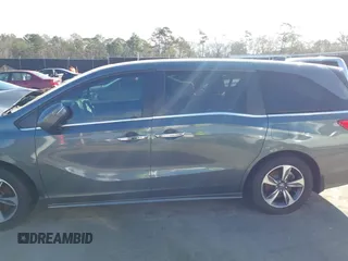 2020 Honda Odyssey Touring z VIN 5FNRL6H8XLB035047, wystawiony jako IAAI lot #41794343 z przebiegiem 57 537 mil mil oraz . Historia ofert i sprzedaży dostępna na DreamBid. Obrazek 14.