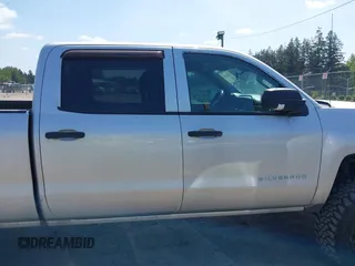 2014 Chevrolet Silverado 1500 LT with VIN 3GCUKREH0EG399090, listed as a IAAI auction lot 42142324 with 104,226 mi miles and . Bid and sale history available at DreamBid. Image 13.