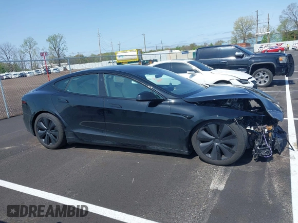 2022 Tesla Model S z VIN 5YJSA1E56NF490064, wystawiony jako IAAI lot #41858477 z przebiegiem Nie podano mil oraz . Historia ofert i sprzedaży dostępna na DreamBid. Obrazek 13.