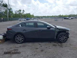 2020 Mazda 3 Select z VIN 3MZBPACL9LM127098, wystawiony jako IAAI lot #41948541 z przebiegiem 67 431 mil mil oraz . Historia ofert i sprzedaży dostępna na DreamBid. Obrazek 13.