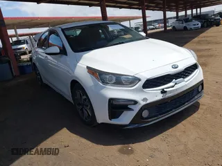 2020 Kia Forte LXS z VIN 3KPF24ADXLE152263, wystawiony jako IAAI lot #42218444 z przebiegiem 88 828 mil mil oraz . Historia ofert i sprzedaży dostępna na DreamBid. Obrazek 1.