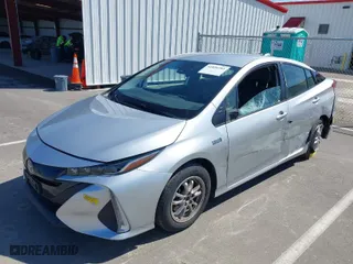 2021 Toyota Prius Prime LE with VIN JTDKAMFP4M3175051, listed as a IAAI auction lot 41856383 with 106,642 mi miles. Bid and sale history available at carsss.com. Image 2.