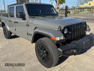 2022 Jeep Gladiator Willys with VIN 1C6HJTAG9NL160131, listed as a Copart auction lot 50428855 with 56,970 mi miles and Clean Title. Bid and sale history available at carsss.com. Image 1.