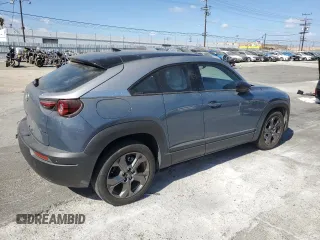 2022 Mazda MX-30 Premium Plus Package with VIN JM1DRADB1N0100639, listed as a Copart auction lot 71770904 with 23,452 mi miles and Salvage Title. Bid and sale history available at carsss.com. Image 3.