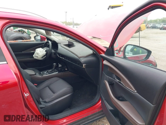 2023 Mazda CX-30 S Premium with VIN 3MVDMBDM3PM511402, listed as a IAAI auction lot 42180001 with 6,189 mi miles and . Bid and sale history available at DreamBid. Image 5.