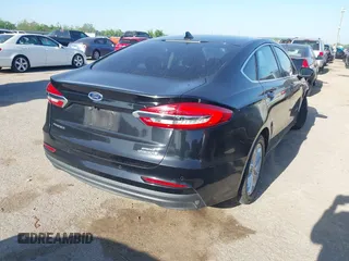 2019 Ford Fusion SEL with VIN 3FA6P0MU5KR203851, listed as a IAAI auction lot 41982637 with 96,954 mi miles and . Bid and sale history available at DreamBid. Image 4.