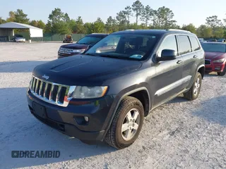 2012 Jeep Grand Cherokee Laredo with VIN 1C4RJFAG5CC234382, listed as a IAAI auction lot 42010153 with 185,078 mi miles. Bid and sale history available at carsss.com. Image 2.