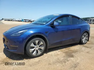 2023 Tesla Model Y Long Range z VIN 7SAYGAEE5PF777264, wystawiony jako Copart lot #56750915 z przebiegiem Nie podano mil oraz Szkoda całkowita • Salvage title. Historia ofert i sprzedaży dostępna na DreamBid. Obrazek 1.