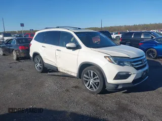 2017 Honda Pilot Elite with VIN 5FNYF6H00HB032386, listed as a IAAI auction lot 41976702 with 153,251 mi miles and . Bid and sale history available at DreamBid. Image 1.