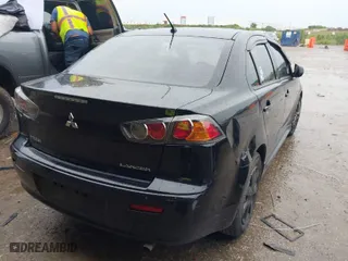 2013 Mitsubishi Lancer ES with VIN JA32U2FU6DU013948, listed as a IAAI auction lot 39435606 with 146,398 mi miles. Bid and sale history available at carsss.com. Image 4.