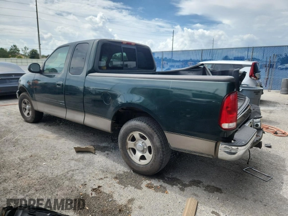 2001 Ford F-150 XL with VIN 1FTRX17L51NA83857, listed as a Copart auction lot 62759145 with 215,961 mi miles and Salvage title. Bid and sale history available at DreamBid. Image 2.