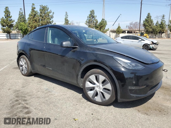 2024 Tesla Model Y Long Range with VIN 7SAYGDEE6RA219456, listed as a Copart auction lot 61855165 with 29,869 mi miles and Salvage title. Bid and sale history available at DreamBid. Image 4.