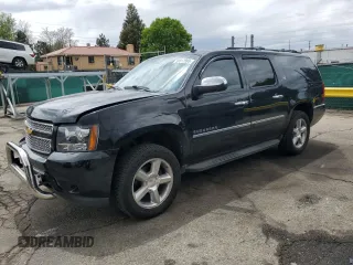 2014 Chevrolet Suburban LTZ with VIN 1GNSKKE70ER233746, listed as a Copart auction lot 56517895 with 160,905 mi miles and Salvage title. Bid and sale history available at DreamBid. Image 1.
