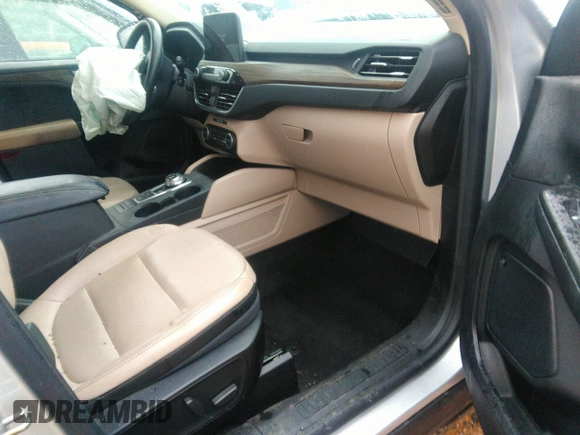 2020 Ford Escape Titanium Hybrid with VIN 1FMCU0DZ8LUB13911, listed as a IAAI auction lot 41249498 with 64,108 mi miles and . Bid and sale history available at DreamBid. Image 5.
