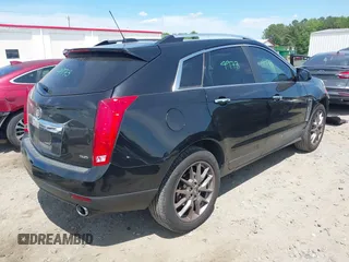 2015 Cadillac SRX Performance Collection z VIN 3GYFNCE30FS549872, wystawiony jako IAAI lot #42201529 z przebiegiem 125 128 mil mil oraz . Historia ofert i sprzedaży dostępna na DreamBid. Obrazek 4.