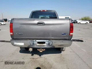 2002 Ford F-150 XL with VIN 1FTPX18L32NB65156, listed as a Copart auction lot 61418955 with 176,622 mi miles and Salvage title. Bid and sale history available at DreamBid. Image 6.