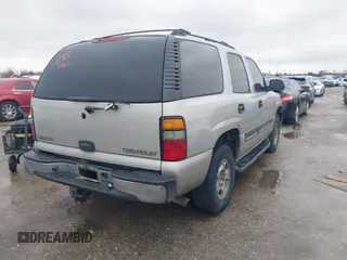 2005 Chevrolet Tahoe LT with VIN 1GNEC13T65R153663, listed as a IAAI auction lot 41425751 with 283,051 mi miles and . Bid and sale history available at DreamBid. Image 4.