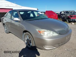 2004 Toyota Camry LE with VIN JTDBE32K940282722, listed as a IAAI auction lot 40608185 with 206,923 mi miles and . Bid and sale history available at DreamBid. Image 1.