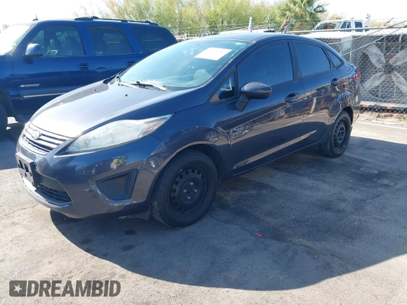 2012 Ford Fiesta S with VIN 3FADP4AJ4CM187553, listed as a IAAI auction lot 41965362 with 136,021 mi miles. Bid and sale history available at carsss.com. Image 2.