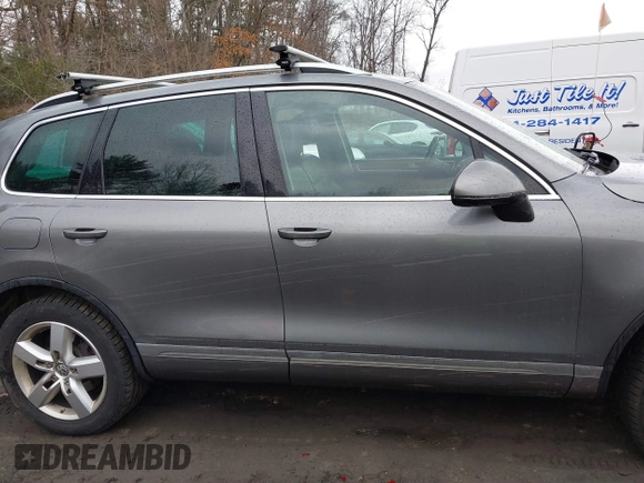 2013 Volkswagen Touareg Lux with VIN WVGEF9BP0DD005082, listed as a IAAI auction lot 41667026 with 140,148 mi miles and . Bid and sale history available at DreamBid. Image 14.