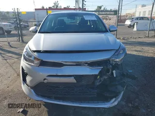 2023 Kia Rio LX with VIN 3KPA24AD1PE599290, listed as a IAAI auction lot 41023283 with 10,027 mi miles and . Bid and sale history available at DreamBid. Image 6.